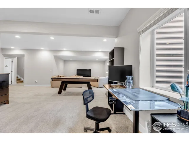 a workspace with furniture and window