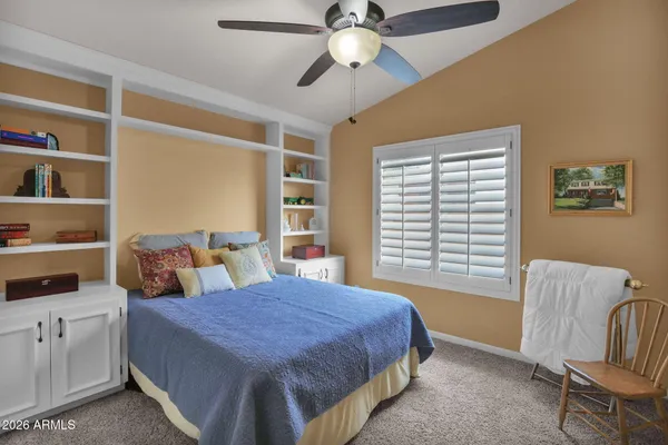 an aerial view of a house with outdoor space lake view and mountain view in back