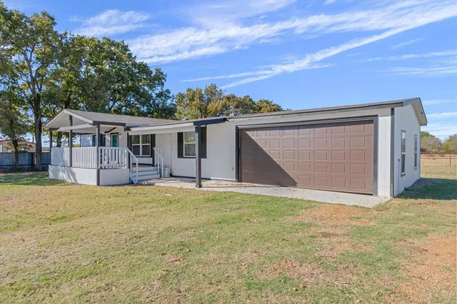 a house with trees in the background