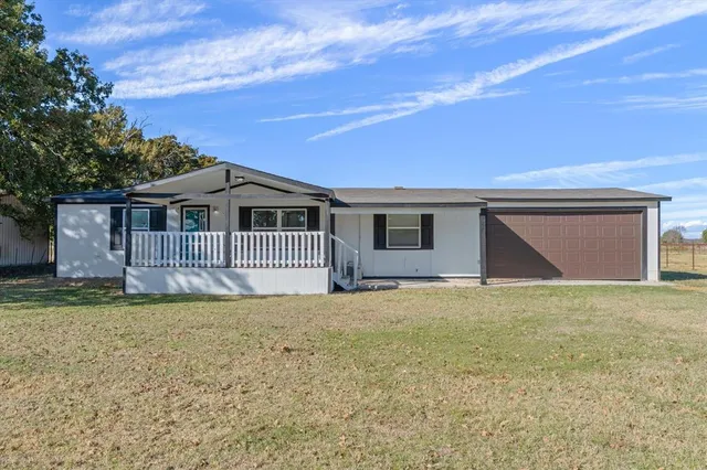 a house with swimming pool in front of it