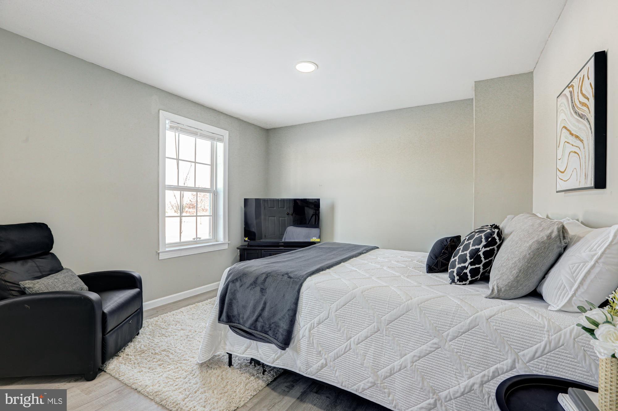 1102 Wickersham Way Middletown, DE 19709 - Photo 17 of 68 a bedroom with a bed and window