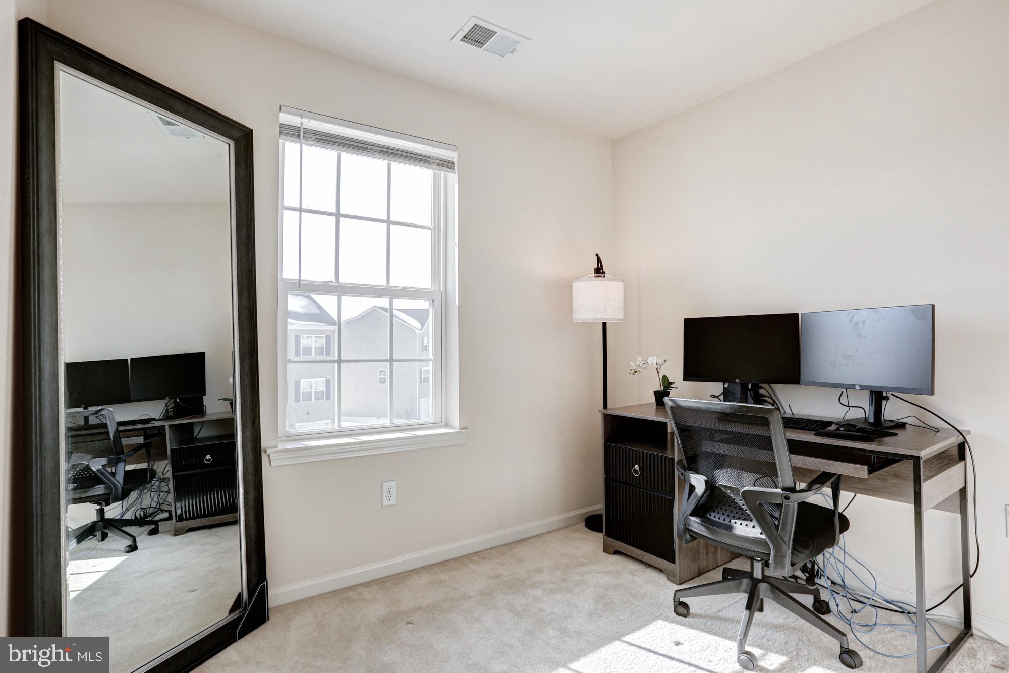 1102 Wickersham Way Middletown, DE 19709 - Photo 53 of 68 a view of a workspace with furniture and a window
