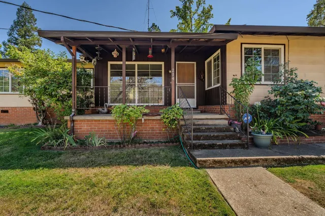 a front view of a house with garden