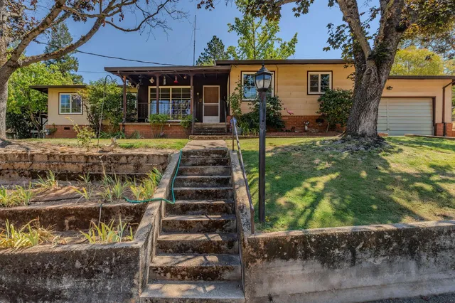 front view of a house with a yard