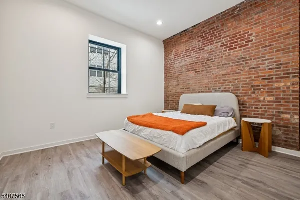 a bedroom with a bed and a table