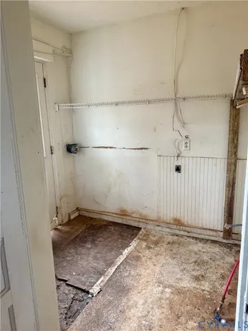 a view of an empty room with windows