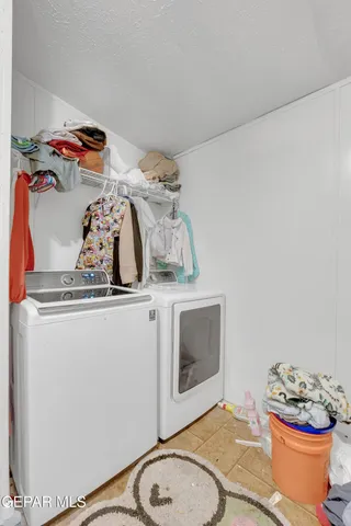 a living room with a fireplace and a wooden floor