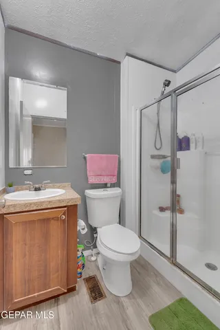 a bedroom with a bed and a cabinets