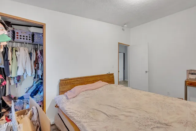 a view of a house with snow on the road