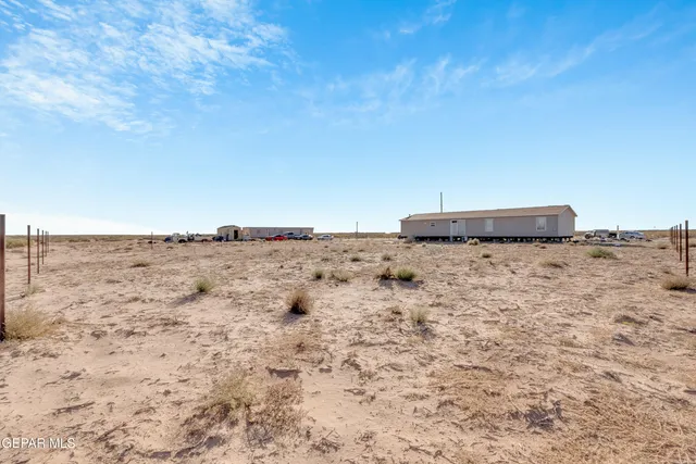an aerial view of residential building with ocean view