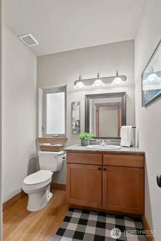 a room with a sink and a mirror