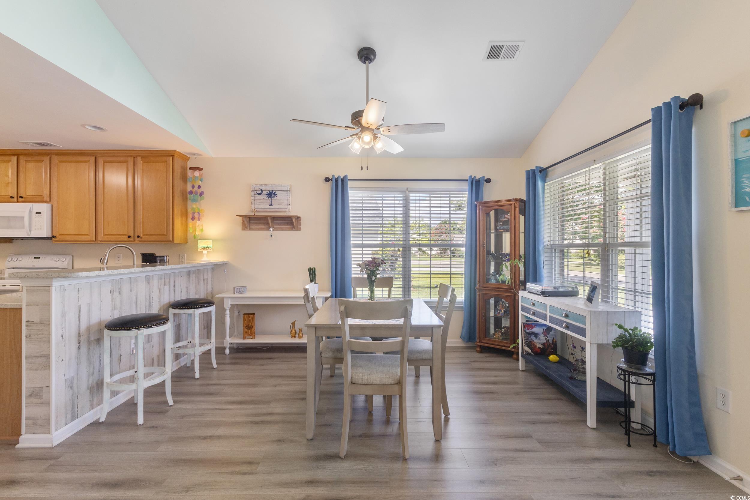 283 Whitchurch Street Murrells Inlet, SC 29576 - Photo 14 of 40 Dining room with vaulted ceiling, a ceiling fan, a