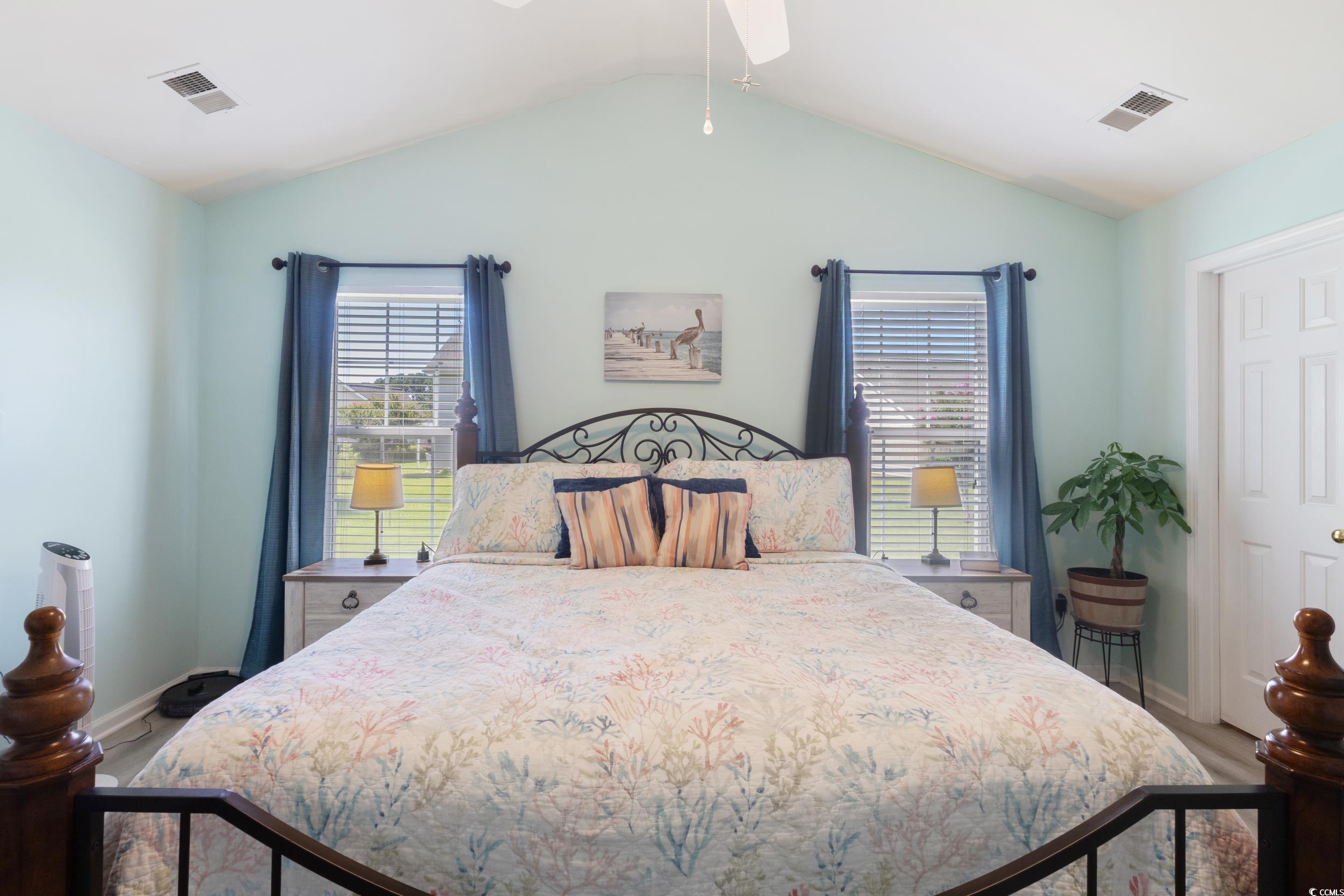283 Whitchurch Street Murrells Inlet, SC 29576 - Photo 32 of 40 Bedroom with lofted ceiling and wood finished floo