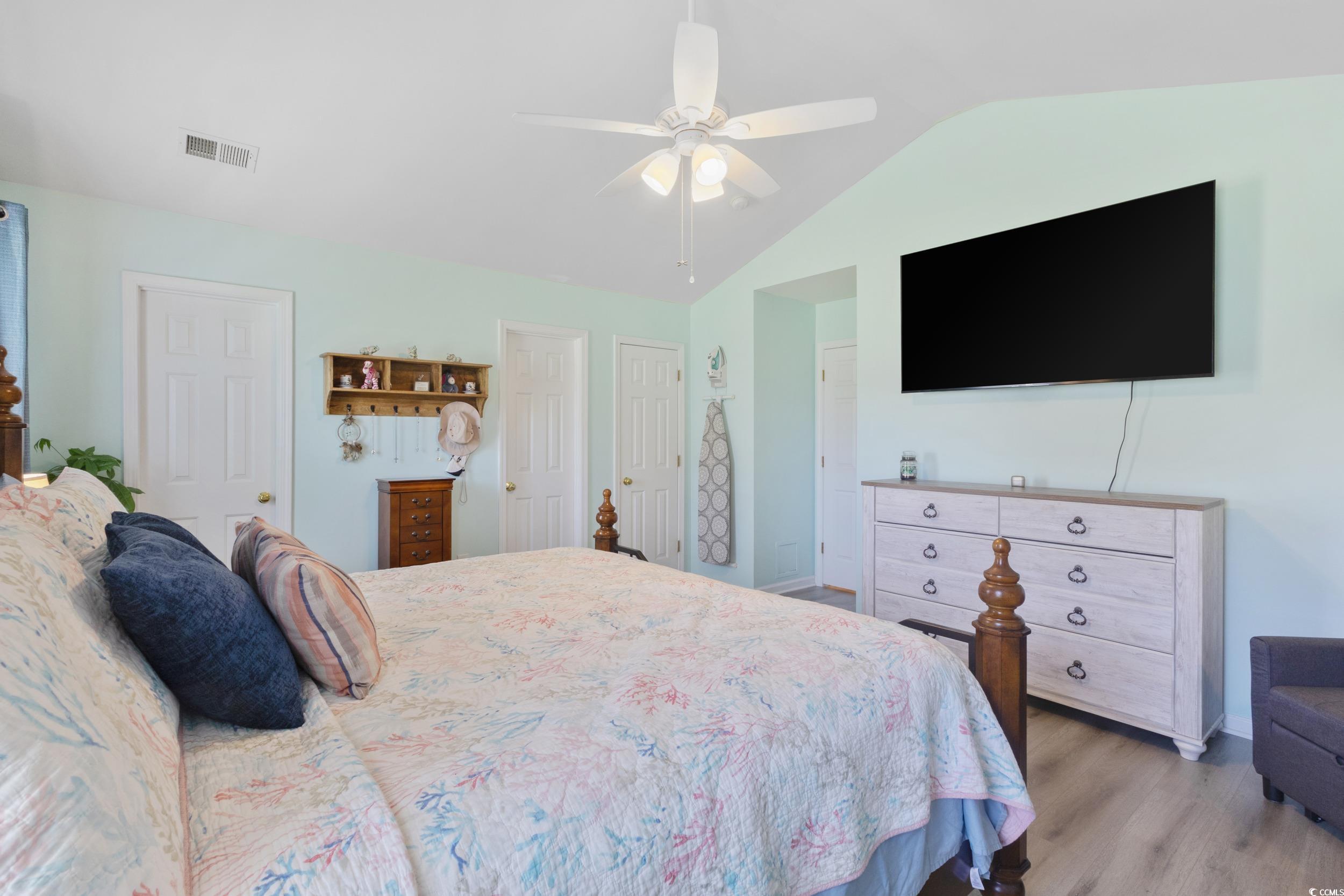 283 Whitchurch Street Murrells Inlet, SC 29576 - Photo 33 of 40 Bedroom featuring vaulted ceiling, light wood fini