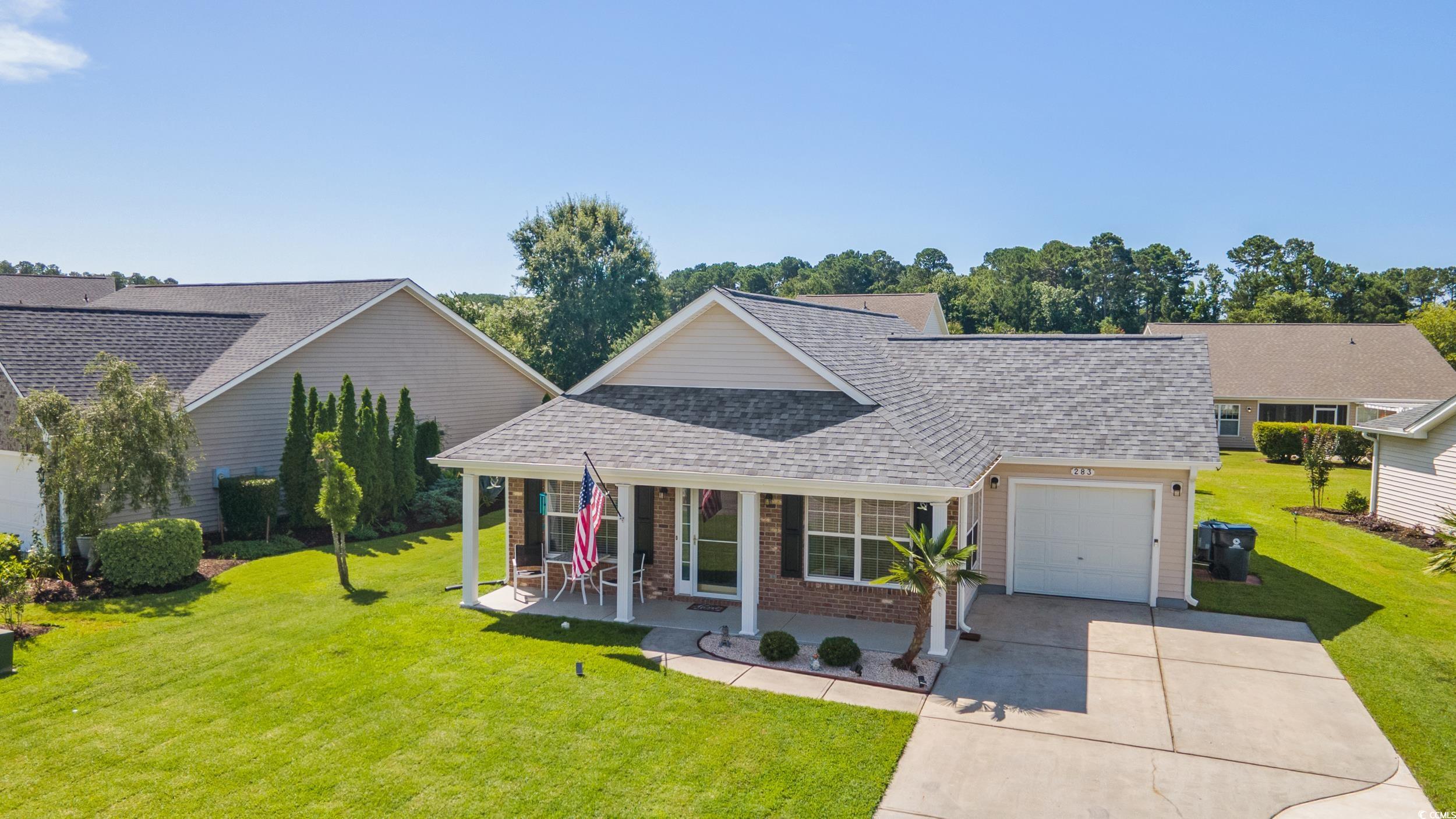283 Whitchurch Street Murrells Inlet, SC 29576 - Photo 4 of 40 Traditional home featuring a shingled roof, an att