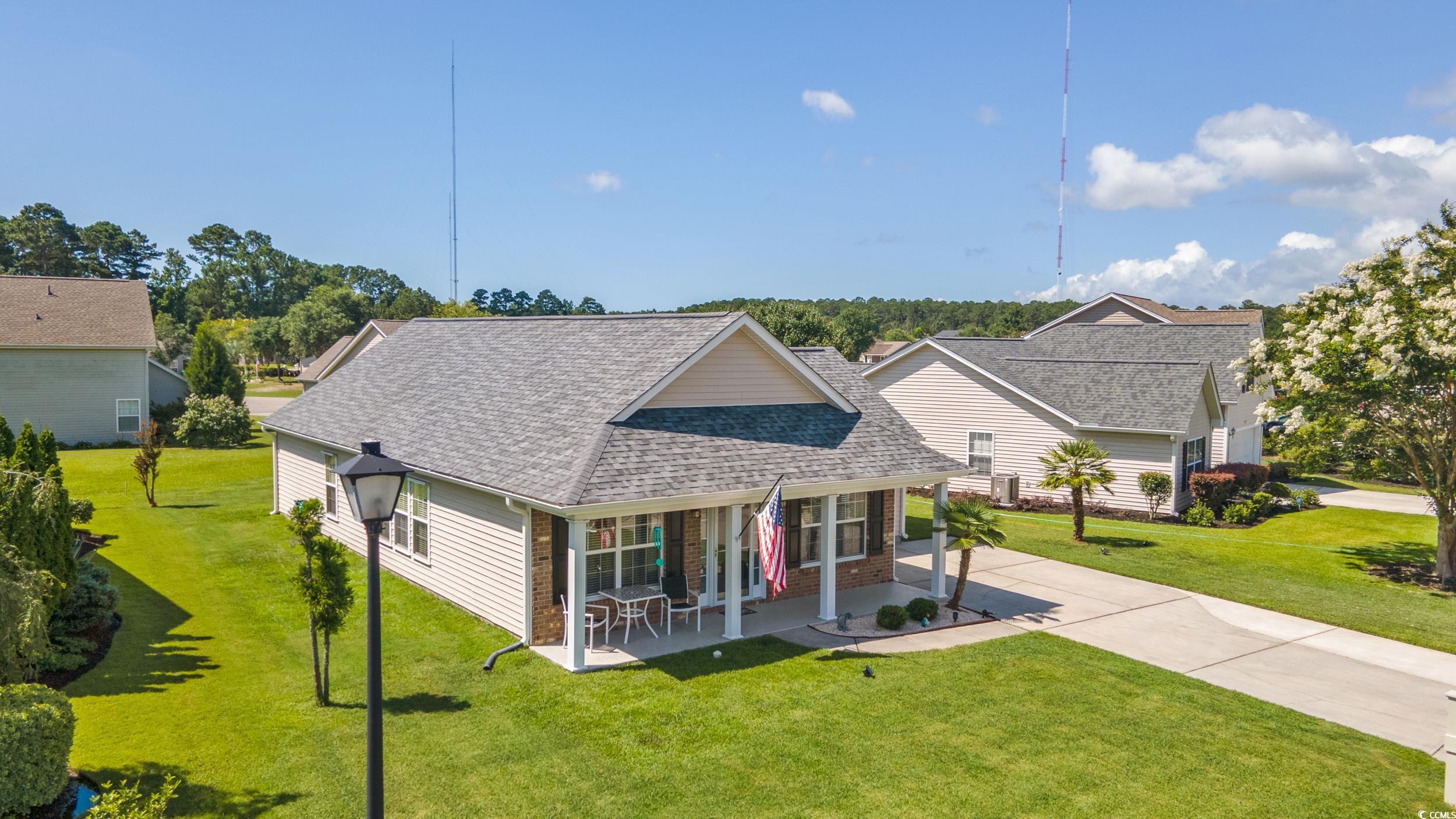 283 Whitchurch Street Murrells Inlet, SC 29576 - Photo 5 of 40 View of front of house with concrete driveway, roo