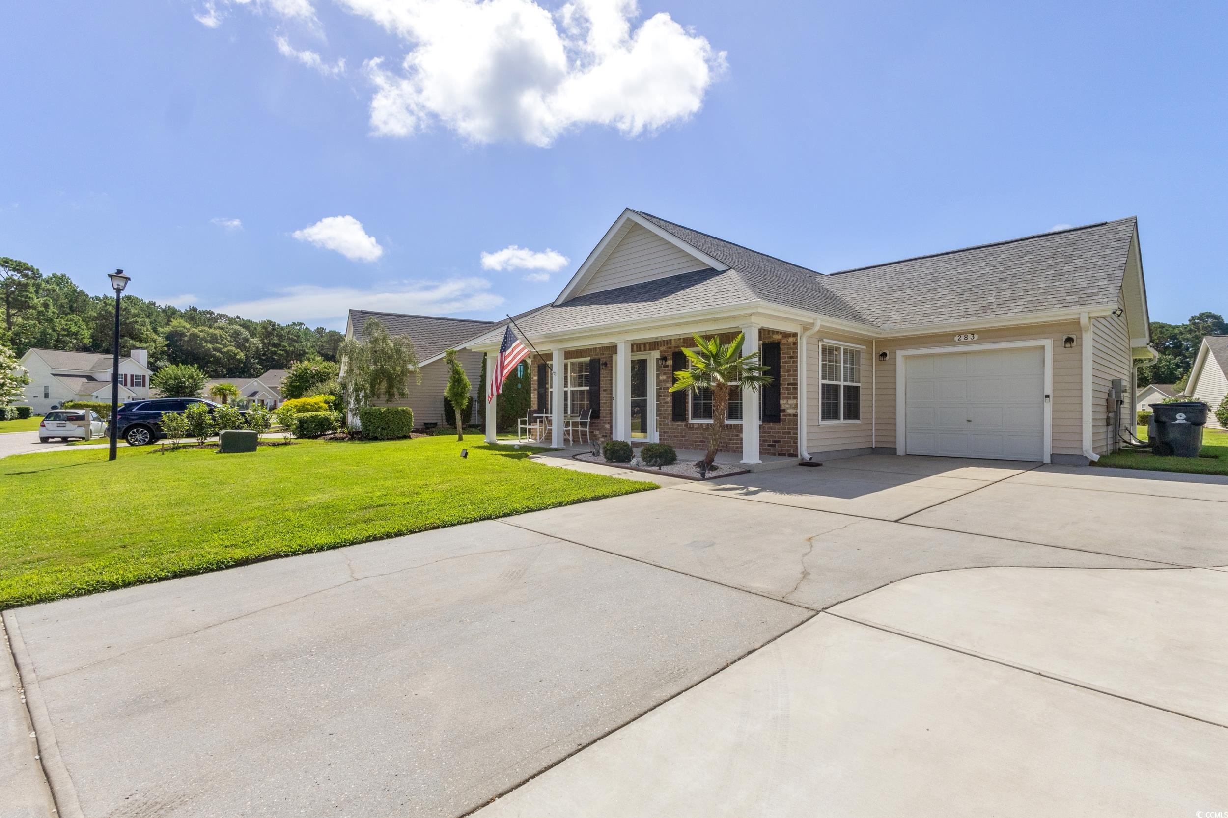 283 Whitchurch Street Murrells Inlet, SC 29576 - Photo 6 of 40 View of front facade with driveway, an attached ga