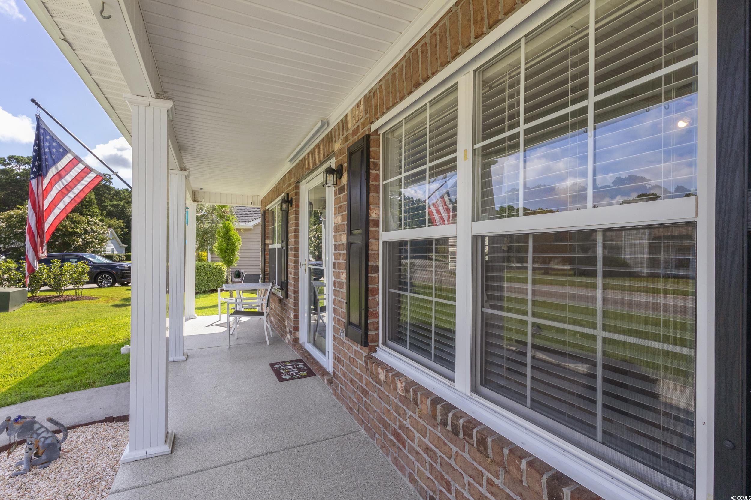 283 Whitchurch Street Murrells Inlet, SC 29576 - Photo 7 of 40 Porch featuring a lawn