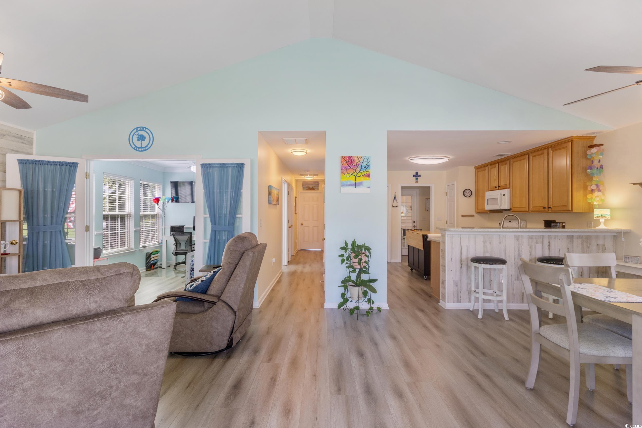 283 Whitchurch Street Murrells Inlet, SC 29576 - Photo 8 of 40 Living area featuring a ceiling fan, light wood-st