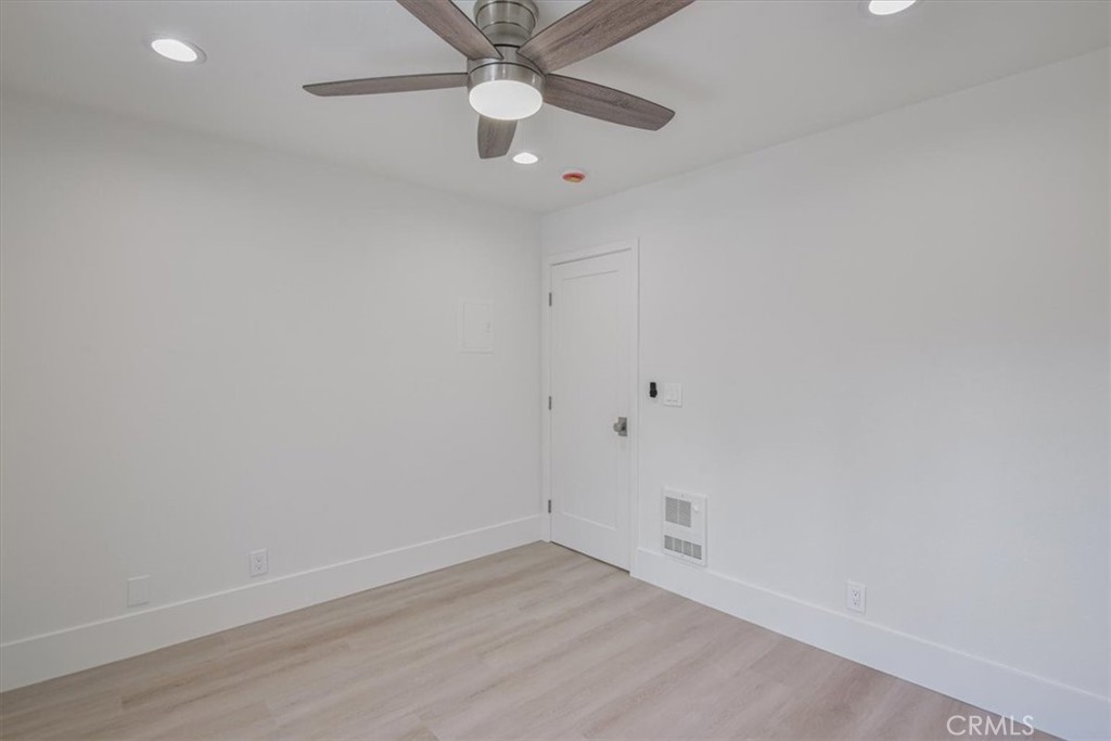 229 Springview Irvine, CA 92620 - Photo 13 of 30 an empty room with a window and ceiling fan