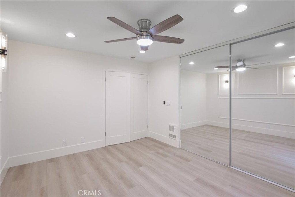 229 Springview Irvine, CA 92620 - Photo 14 of 30 an empty room with fan and a ceiling fan