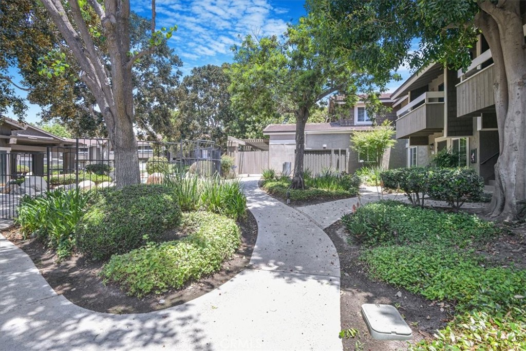 229 Springview Irvine, CA 92620 - Photo 27 of 30 a front view of a house with a yard and outdoor seating