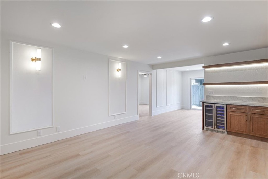 229 Springview Irvine, CA 92620 - Photo 8 of 30 an empty room with wooden floor and windows