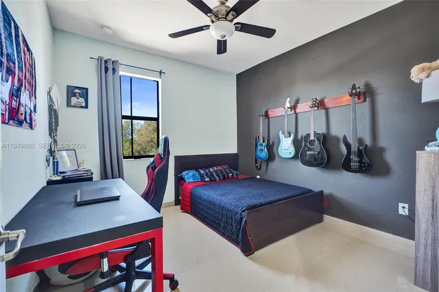 a bedroom with furniture and a chandelier