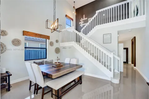 a view of a dining table and chairs in a room
