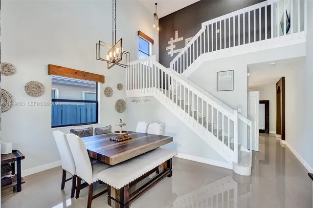 a view of a dining table and chairs in a room