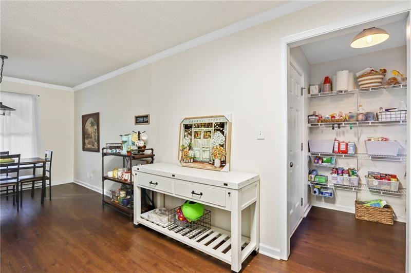 228 Shady Lane Canton, GA 30115 - Photo 18 of 36 a living room with furniture and a wooden floor
