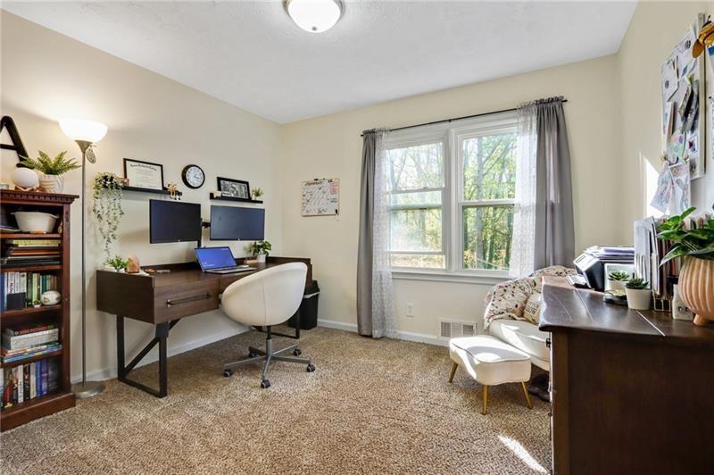 228 Shady Lane Canton, GA 30115 - Photo 28 of 36 a living room with furniture a window and a flat screen tv