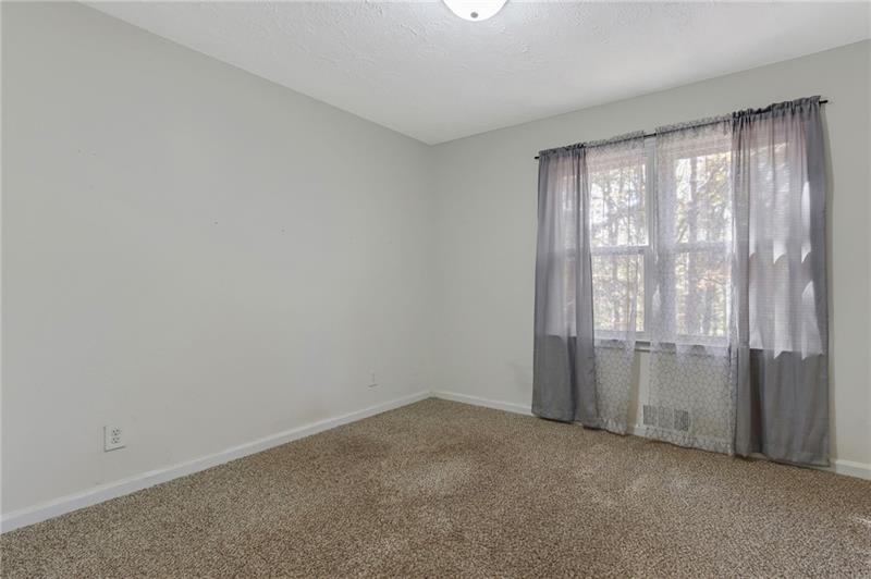 228 Shady Lane Canton, GA 30115 - Photo 29 of 36 a view of an empty room with a window