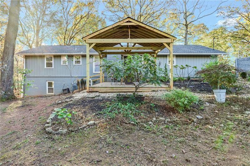 228 Shady Lane Canton, GA 30115 - Photo 31 of 36 a front view of a house with garden