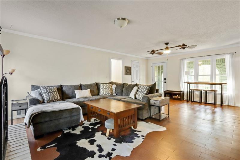 228 Shady Lane Canton, GA 30115 - Photo 4 of 36 a living room with furniture and wooden floor