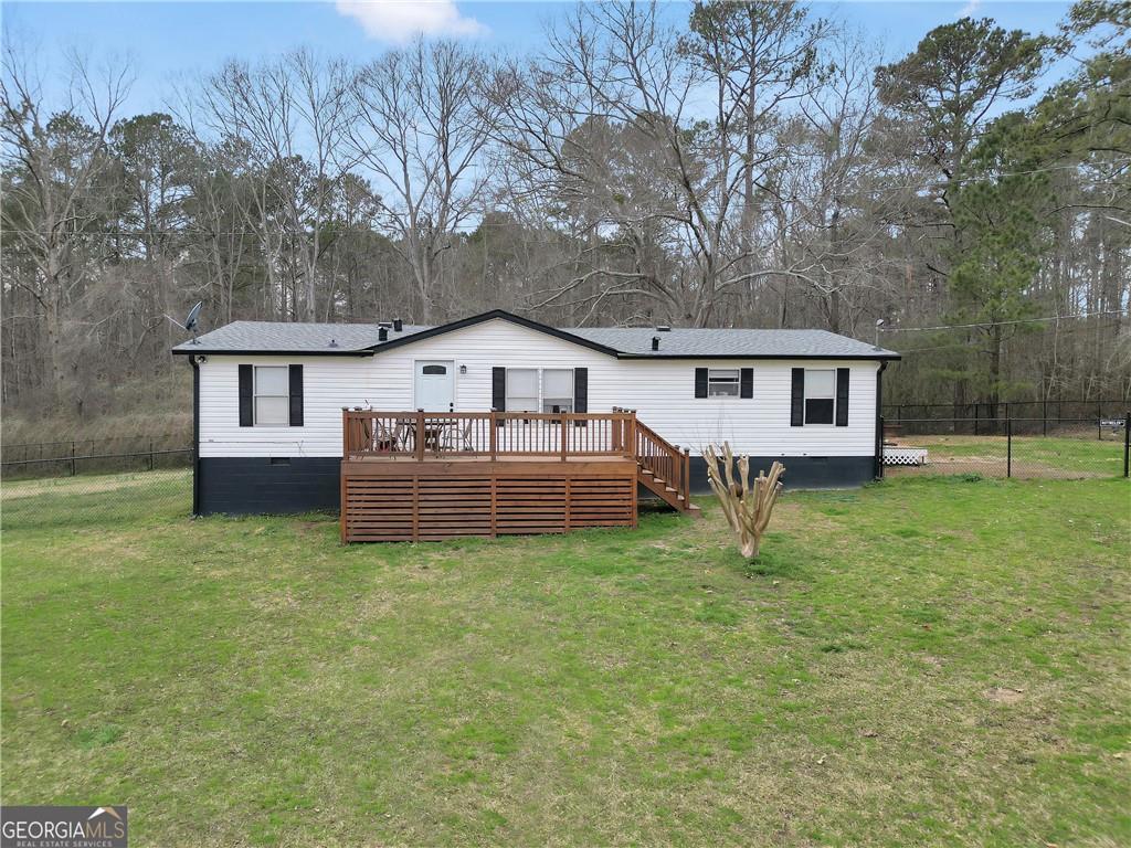 926 Silver Dollar Road Milner, GA 30257 - Photo 1 of 1 a house view with a garden space