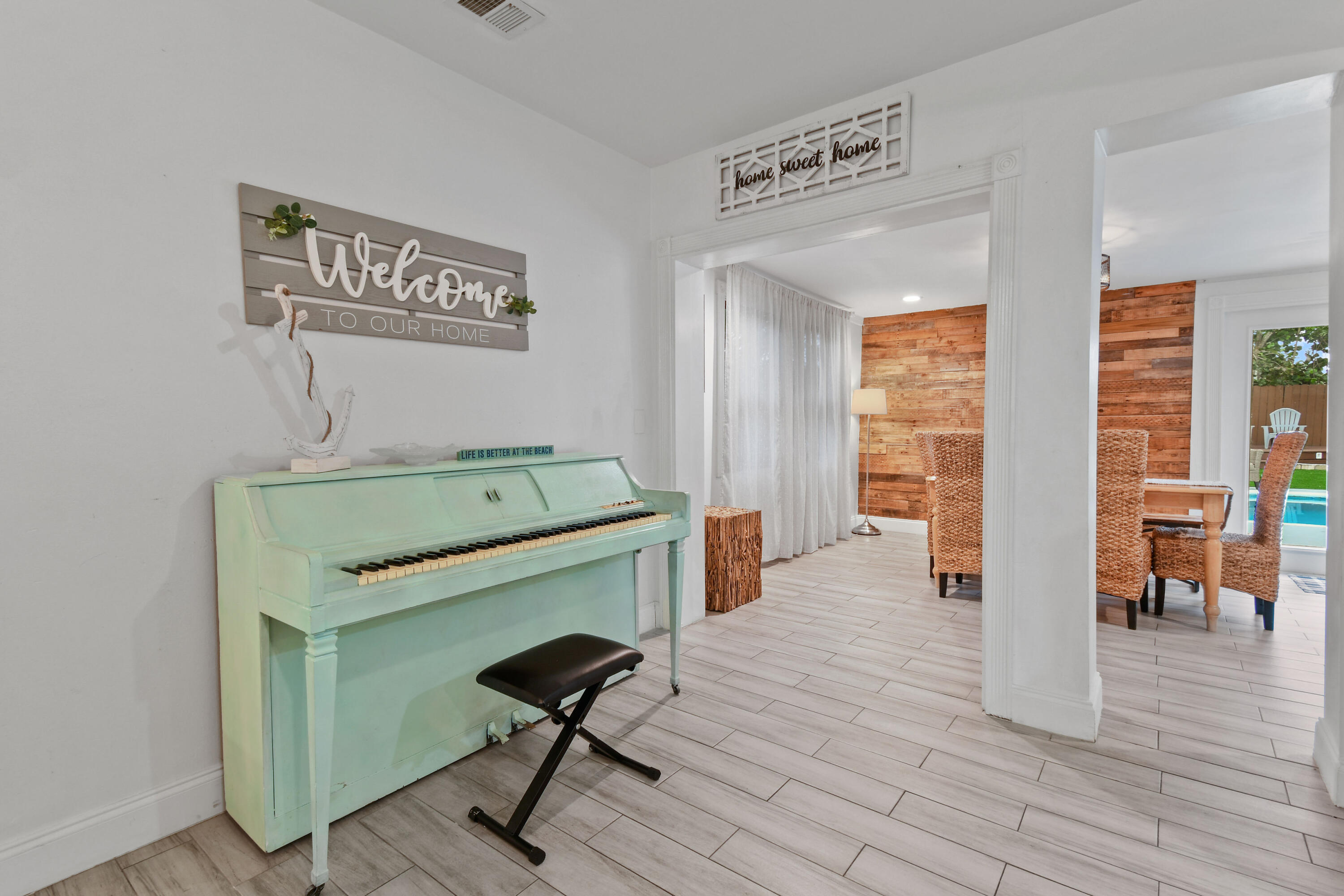 973 Laurel Road North Palm Beach, FL 33408 - Photo 14 of 57 a room that has a couch and a chair in it