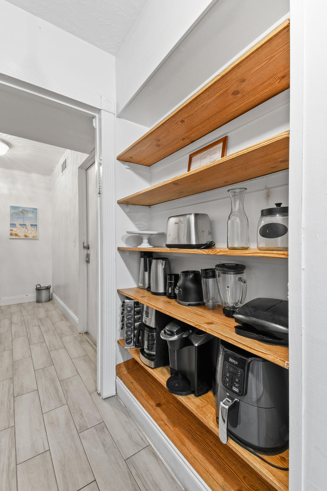 973 Laurel Road North Palm Beach, FL 33408 - Photo 17 of 57 a view of an entryway with wooden floor