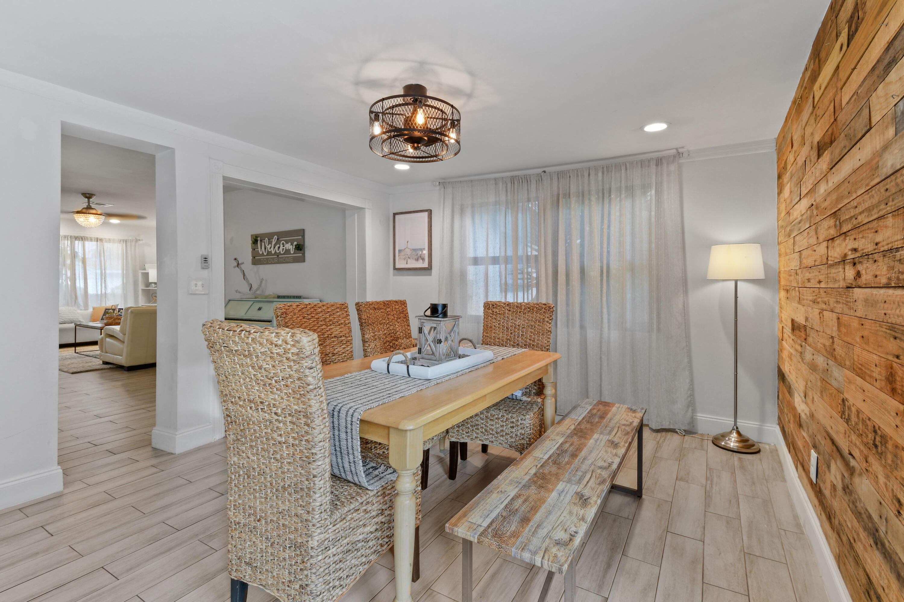 973 Laurel Road North Palm Beach, FL 33408 - Photo 19 of 57 a view of a dining room with furniture and wooden floor
