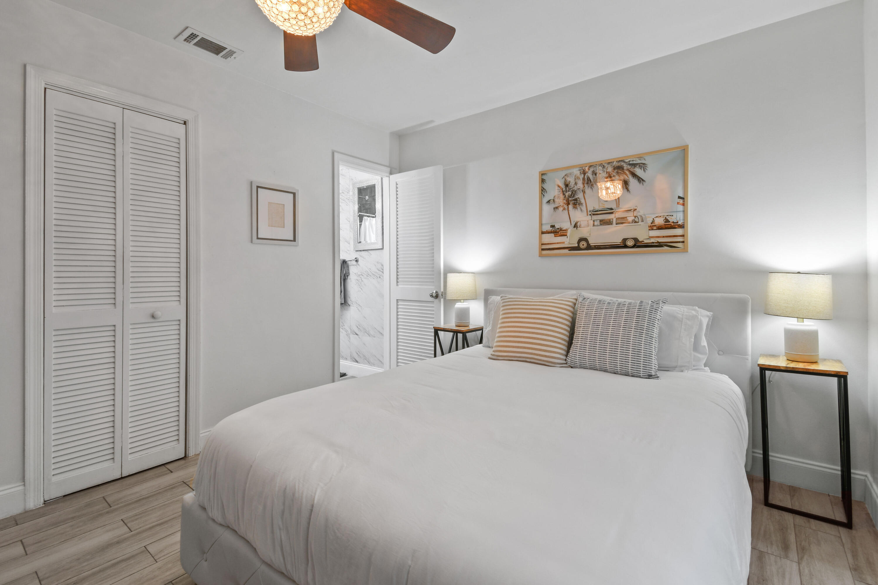 973 Laurel Road North Palm Beach, FL 33408 - Photo 24 of 57 a bed room with a bed and a night stand