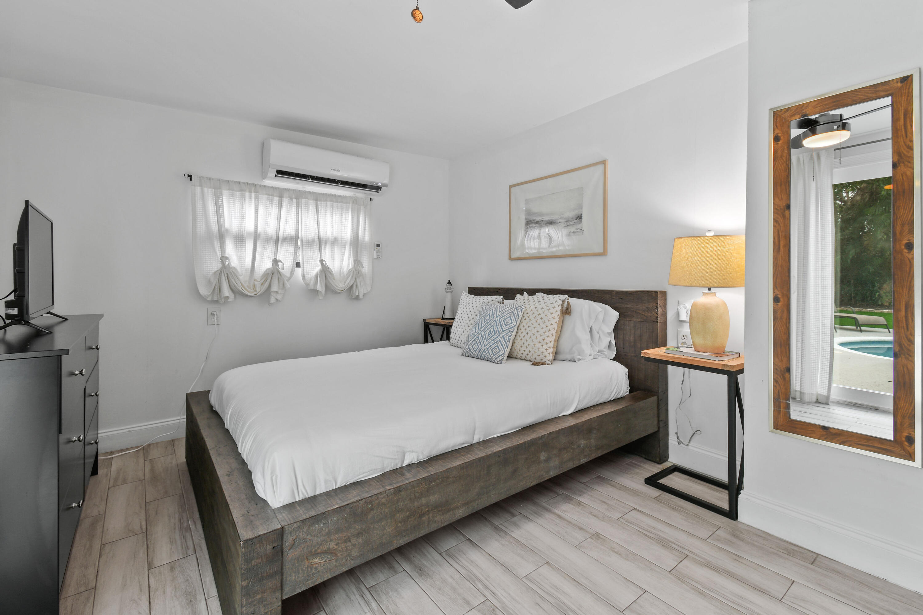 973 Laurel Road North Palm Beach, FL 33408 - Photo 28 of 57 a bedroom with a bed and window