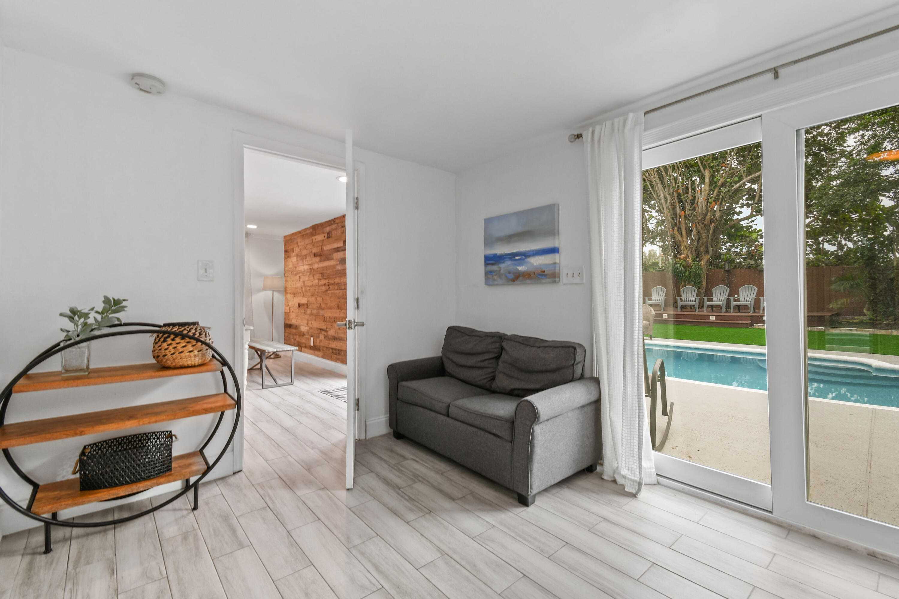 973 Laurel Road North Palm Beach, FL 33408 - Photo 29 of 57 a living room with furniture and a wooden floor