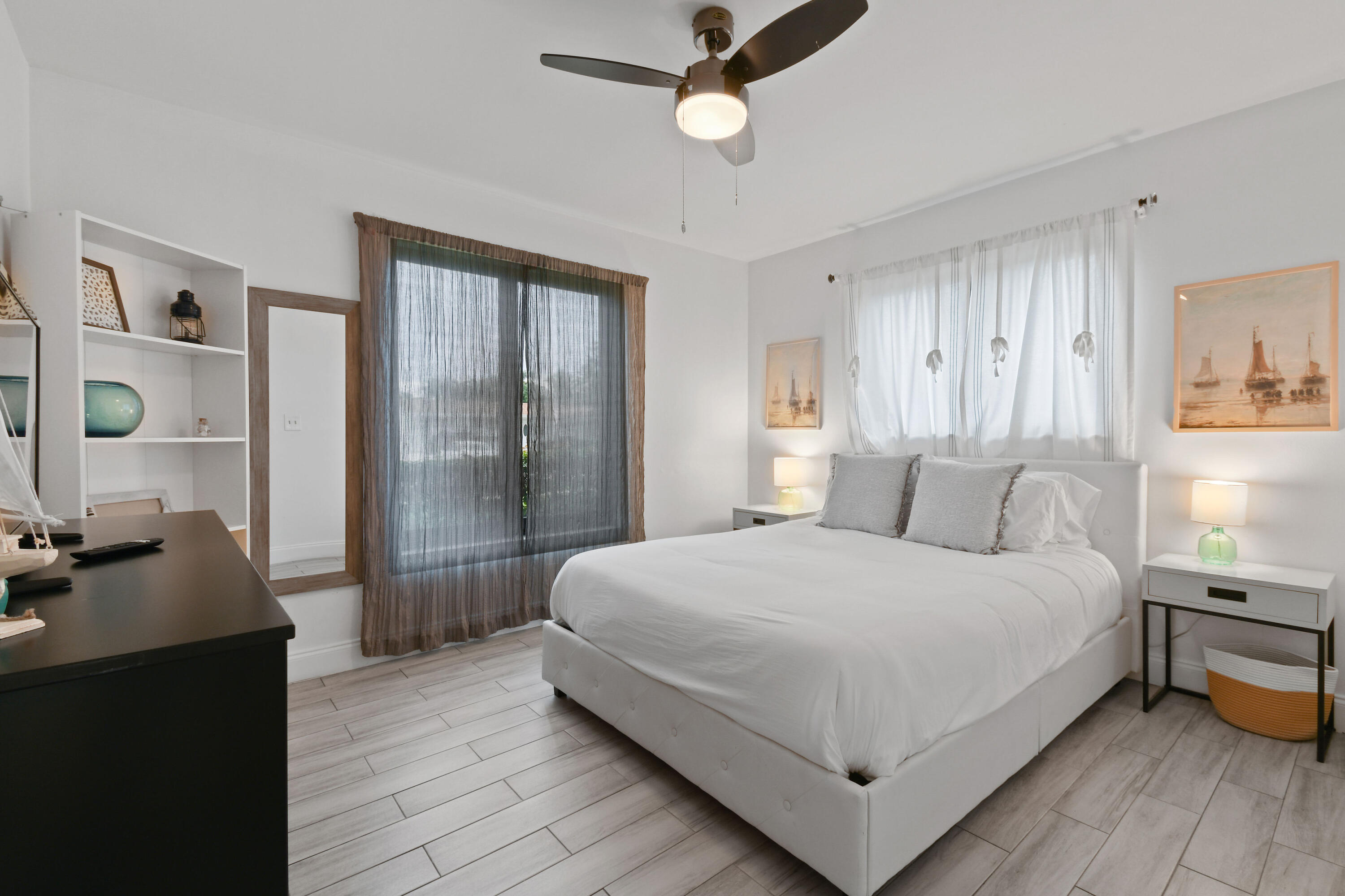 973 Laurel Road North Palm Beach, FL 33408 - Photo 30 of 57 a bedroom with a large bed and a window