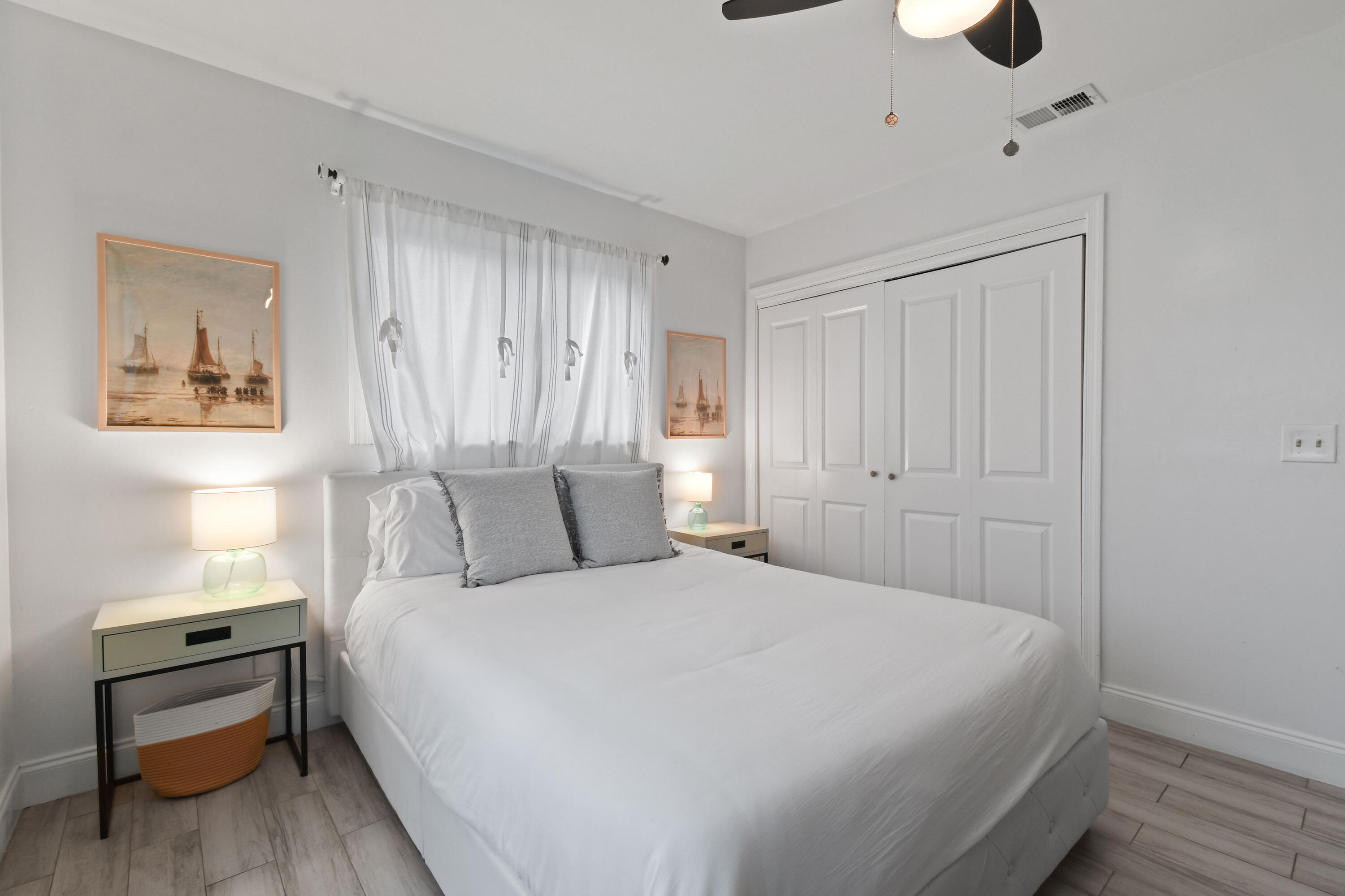 973 Laurel Road North Palm Beach, FL 33408 - Photo 31 of 57 a bedroom with a bed and a chandelier