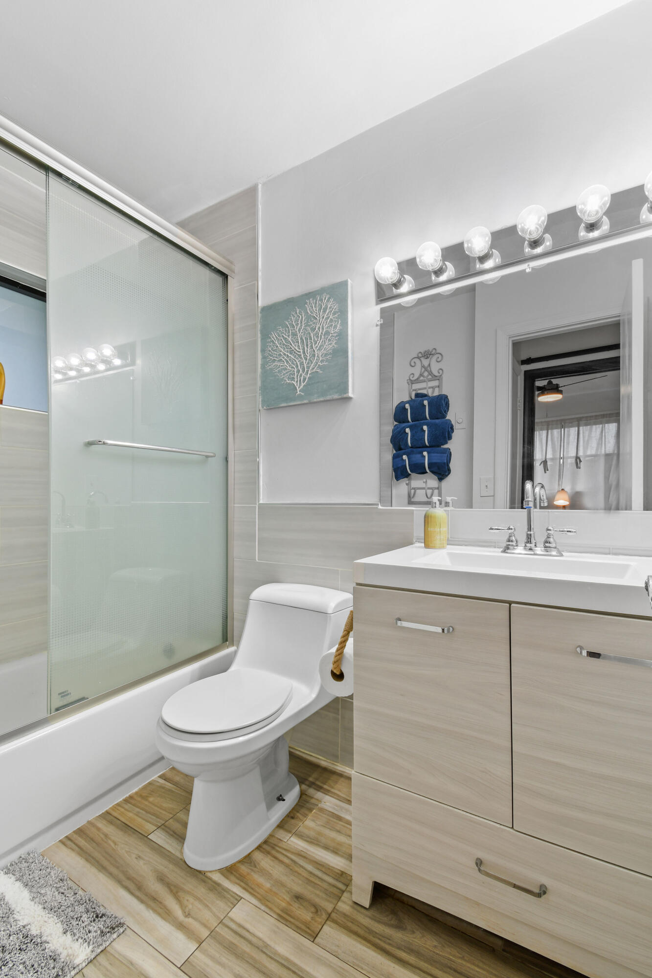 973 Laurel Road North Palm Beach, FL 33408 - Photo 32 of 57 a bathroom with a sink toilet and shower