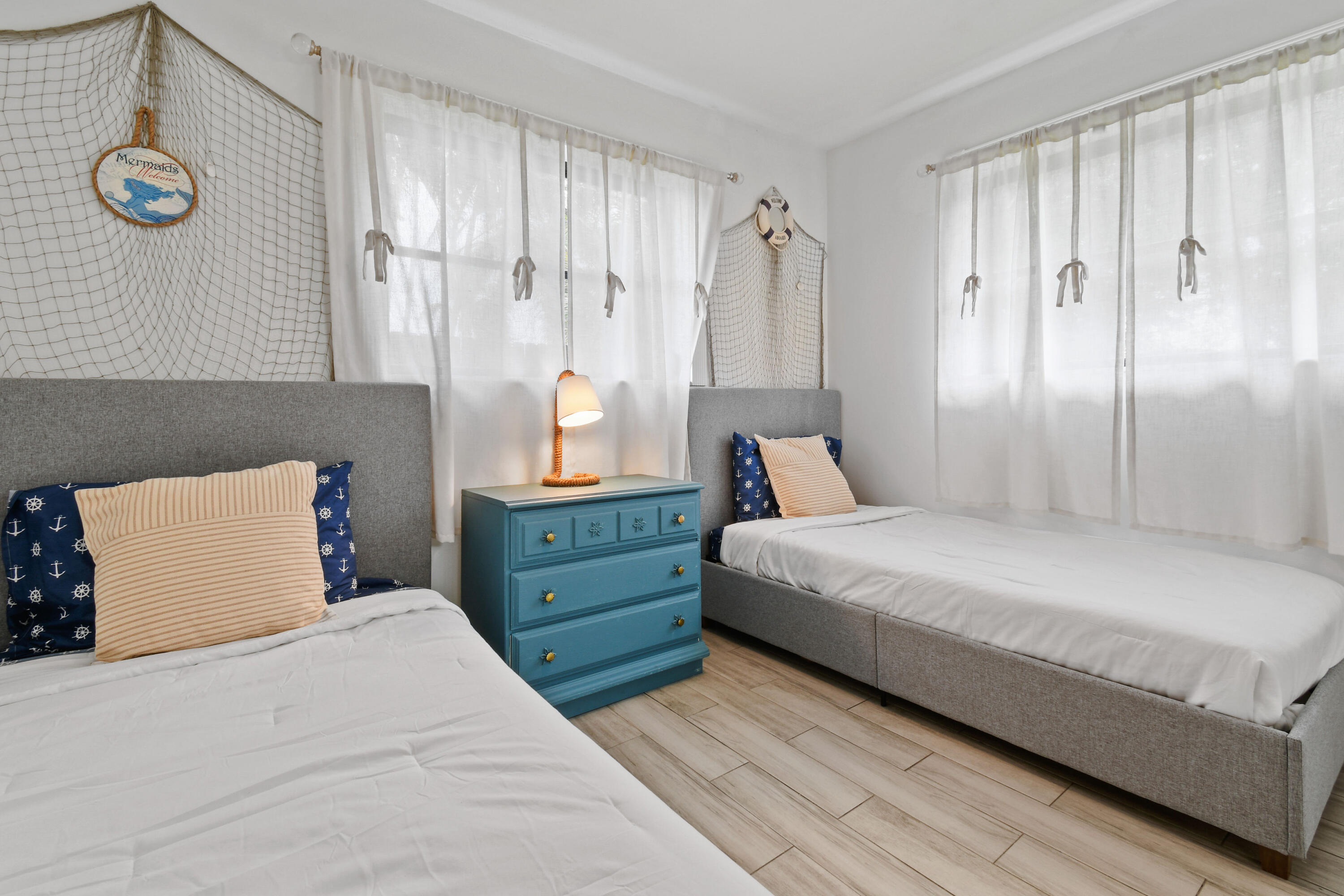 973 Laurel Road North Palm Beach, FL 33408 - Photo 35 of 57 a bedroom with a large bed and a window