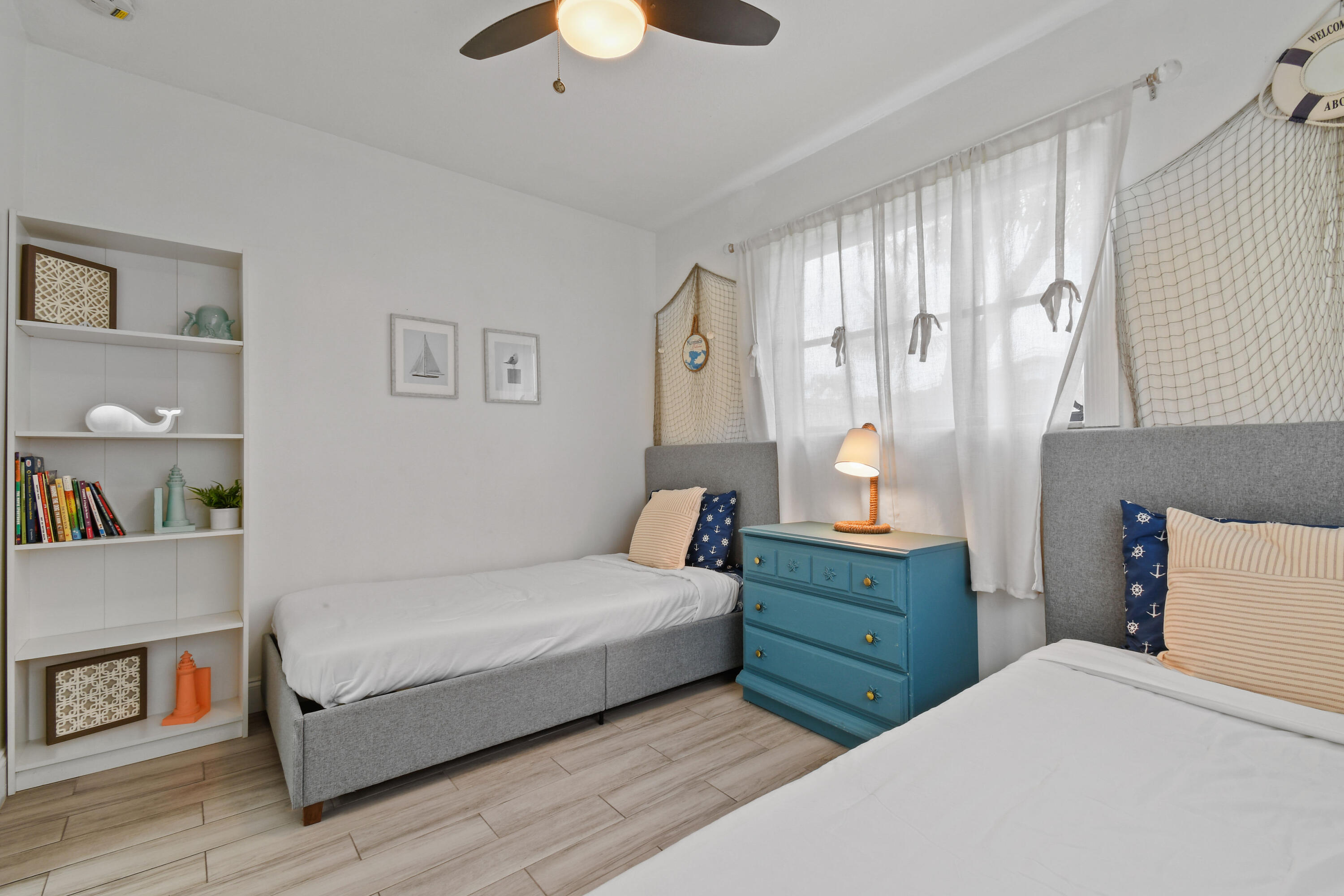 973 Laurel Road North Palm Beach, FL 33408 - Photo 36 of 57 a bedroom with a bed and a book shelf