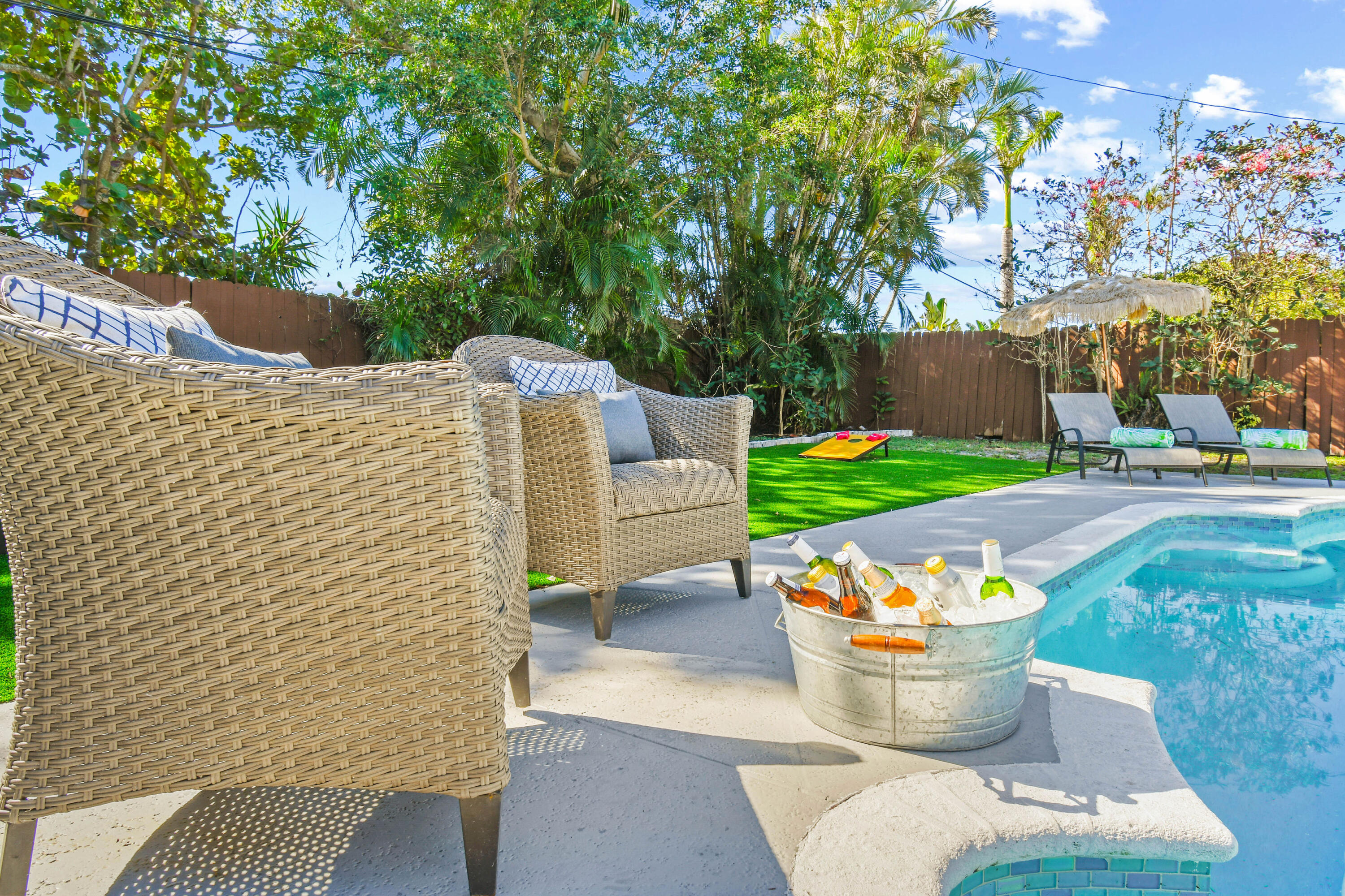 973 Laurel Road North Palm Beach, FL 33408 - Photo 37 of 57 a view of a patio with table and chairs and potted plants
