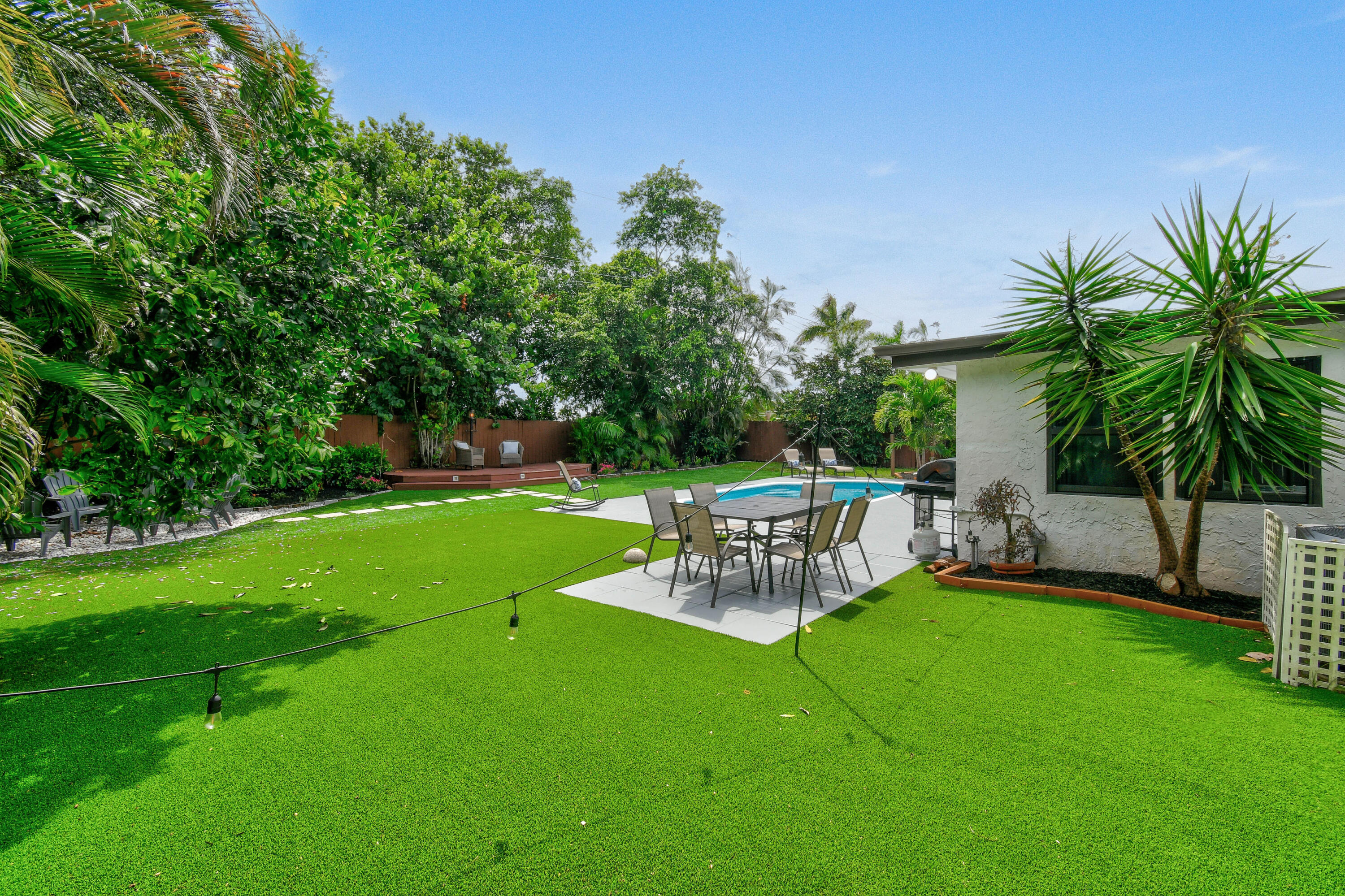 973 Laurel Road North Palm Beach, FL 33408 - Photo 46 of 57 a view of a chair and table of the garden