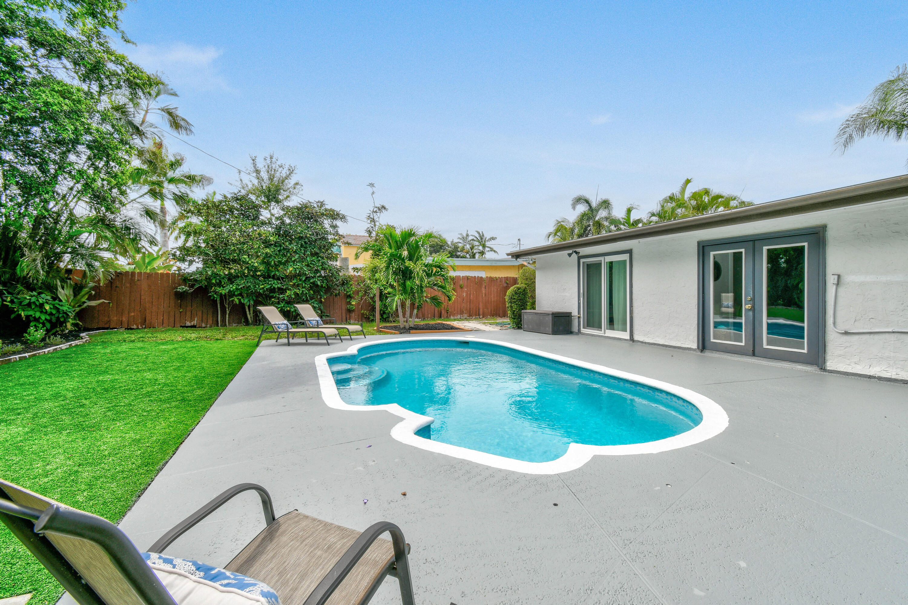 973 Laurel Road North Palm Beach, FL 33408 - Photo 47 of 57 a view of outdoor space yard swimming pool and patio